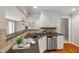 Well-designed kitchen with open sightlines to the living areas and natural lighting at 313 Glen Echo Ln # J, Cary, NC 27518