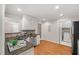 Fully equipped kitchen with stainless appliances, and a separate laundry area at 313 Glen Echo Ln # J, Cary, NC 27518