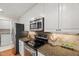 Well-lit kitchen with stainless steel appliances and plenty of storage at 313 Glen Echo Ln # J, Cary, NC 27518