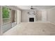 Living room features a fireplace, patio access, and natural light, creating a comfortable and inviting atmosphere at 313 Glen Echo Ln # J, Cary, NC 27518