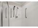 Shower stall featuring multiple grab bars and white tile at 313 Glen Echo Ln # J, Cary, NC 27518