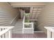 Inviting staircase with wooden accents leads to the entrance of this well-maintained home at 313 Glen Echo Ln # J, Cary, NC 27518