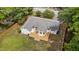 An aerial view of the home showcasing the deck, fenced yard, and mature landscaping at 314 Wrenn St, Apex, NC 27502