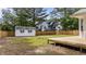 This house features a wooden deck, white shed, and backyard surrounded by a wooden fence at 314 Wrenn St, Apex, NC 27502