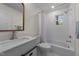 Bright bathroom featuring a modern vanity, shower with white subway tile, and ample natural light at 314 Wrenn St, Apex, NC 27502