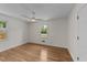 Serene bedroom with hardwood floors, a modern ceiling fan, and bright windows at 314 Wrenn St, Apex, NC 27502