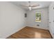 Comfortable bedroom with hardwood floors, a window, and a modern ceiling fan at 314 Wrenn St, Apex, NC 27502