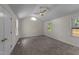 Spacious bedroom with neutral walls, plush carpeting, vaulted ceiling, and natural light from multiple windows at 314 Wrenn St, Apex, NC 27502