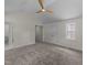 A spacious bedroom with neutral walls, carpeted floors, and multiple windows for ample natural light at 314 Wrenn St, Apex, NC 27502