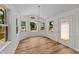 Bright dining room with natural light from large windows and an exterior door at 314 Wrenn St, Apex, NC 27502