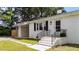 Home exterior with brick steps leading to the front door, complemented by black iron railings at 314 Wrenn St, Apex, NC 27502