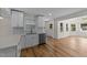 Beautiful kitchen featuring white cabinetry, stainless steel dishwasher, and a view of the backyard at 314 Wrenn St, Apex, NC 27502