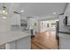 Updated kitchen featuring quartz countertops, stainless steel appliances, and open layout at 314 Wrenn St, Apex, NC 27502