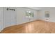 Inviting living room with freshly painted walls, wood floors and natural light at 314 Wrenn St, Apex, NC 27502