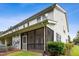 View of the back porch with a screened in area, offering an enjoyable outdoor space at 3141 Rapid Falls Rd, Cary, NC 27519