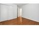 Bedroom featuring hardwood floors, closet, and ensuite bathroom at 3141 Rapid Falls Rd, Cary, NC 27519