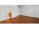 Bedroom featuring hardwood floors and ensuite bathroom at 3141 Rapid Falls Rd, Cary, NC 27519