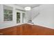 Bright dining area featuring hardwood floors, neutral walls, and access to the backyard at 3141 Rapid Falls Rd, Cary, NC 27519