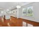 Bright dining area featuring hardwood floors, and natural light streaming through the windows at 3141 Rapid Falls Rd, Cary, NC 27519