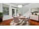 Charming dining area with table set for four, complemented by stylish decor and warm ambiance at 3141 Rapid Falls Rd, Cary, NC 27519