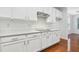 Stylish kitchen with sleek white cabinets, stainless steel appliances, and modern finishes at 3141 Rapid Falls Rd, Cary, NC 27519