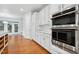 Modern kitchen with white cabinets, stainless steel appliances, and spacious layout at 3141 Rapid Falls Rd, Cary, NC 27519