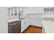 Well-equipped kitchen with stainless steel appliances, sleek countertops, and ample cabinet space and hardwood floors at 3141 Rapid Falls Rd, Cary, NC 27519