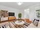 Bright living room features hardwood floors and stylish furnishings, offering a comfortable living space at 3141 Rapid Falls Rd, Cary, NC 27519