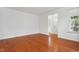 Bright living room featuring hardwood floors, neutral walls, and ample natural light at 3141 Rapid Falls Rd, Cary, NC 27519