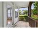 Inviting screened porch with a view of the community and lush landscaping at 3141 Rapid Falls Rd, Cary, NC 27519