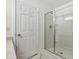 Glass enclosed shower features a bright white interior at 3141 Rapid Falls Rd, Cary, NC 27519