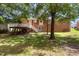 This backyard has a large deck and access to the house at 408 N Stewart St, Clayton, NC 27520