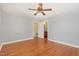 Bedroom with hardwood floors and a doorway to an ensuite bathroom at 408 N Stewart St, Clayton, NC 27520