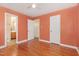 Bedroom featuring hardwood floors and entry to ensuite bathroom at 408 N Stewart St, Clayton, NC 27520