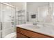 Well-lit bathroom with glass shower doors, modern shelving, and tile flooring at 425 Liberty Hill, Morrisville, NC 27560
