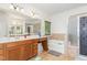 Bathroom with large mirror, shower, and soaking tub at 425 Liberty Hill, Morrisville, NC 27560