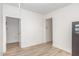 Well-lit bedroom with light wood floors and two doorways at 425 Liberty Hill, Morrisville, NC 27560