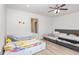 Bright ' bedroom featuring twin beds and light wood floors at 425 Liberty Hill, Morrisville, NC 27560
