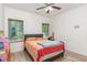 Bedroom featuring a bed with an orange paisley comforter and two windows at 425 Liberty Hill, Morrisville, NC 27560