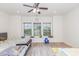 Well-lit ' bedroom with ceiling fan and view to exterior at 425 Liberty Hill, Morrisville, NC 27560