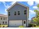 Exterior view of home with gray siding, white garage door, and blue sky at 425 Liberty Hill, Morrisville, NC 27560