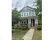 Charming two-story home with blue siding, brick accents, and a welcoming front porch at 425 Liberty Hill, Morrisville, NC 27560