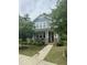 Charming two-story home with blue siding, brick accents, and a welcoming front porch at 425 Liberty Hill, Morrisville, NC 27560