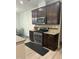 Kitchen with stainless steel stove, microwave, granite counters, and dark wood cabinets at 425 Liberty Hill, Morrisville, NC 27560