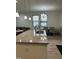 Kitchen featuring granite countertops and stainless sink with dining space in the background at 425 Liberty Hill, Morrisville, NC 27560