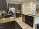 A well-appointed kitchen with dark wood cabinets, stainless steel appliances, and granite countertops at 425 Liberty Hill, Morrisville, NC 27560