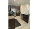 A well-appointed kitchen with dark wood cabinets, stainless steel appliances, and granite countertops at 425 Liberty Hill, Morrisville, NC 27560