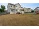 Large backyard featuring a deck, screened in porch and ample space for activities at 453 Granite Saddle Dr, Rolesville, NC 27571