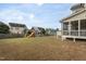 Well-sized backyard featuring a playset, offering ample space for recreation and Gathering fun at 453 Granite Saddle Dr, Rolesville, NC 27571
