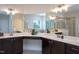 Spacious bathroom with a corner vanity, large mirrors, and a walk-in shower offering a spa-like experience at 453 Granite Saddle Dr, Rolesville, NC 27571